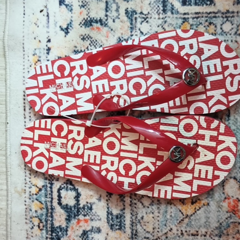 Michael Kors flip flops sz 8 red.